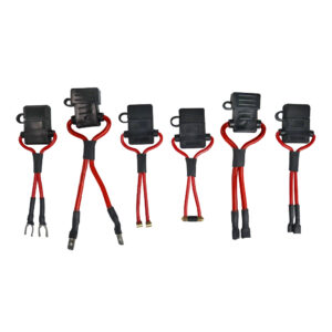 a set of fuse holders with red handles on a white background .